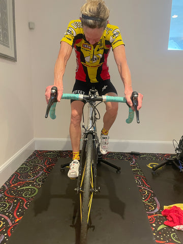 female cyclist on an indoor trainer bike