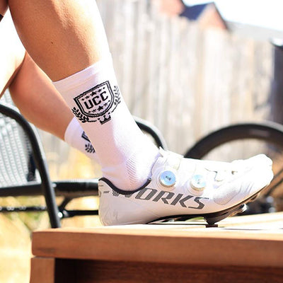 Custom DeFeet cycling socks for UCC on a foot in a cycling shoe