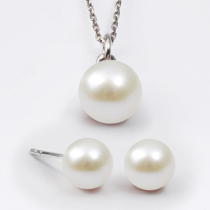 pearl necklace and diamond earrings