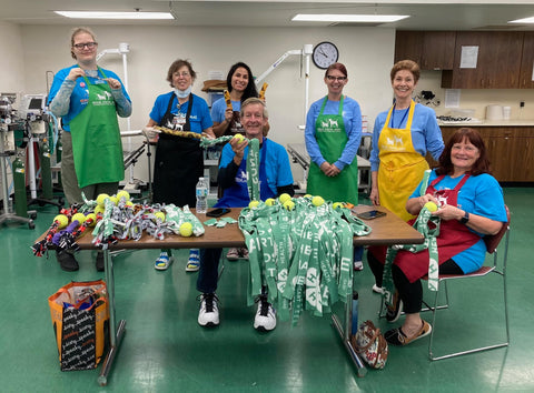 Volunteers at Palm Beach County Animal Care and Control making toys for dogs and cats