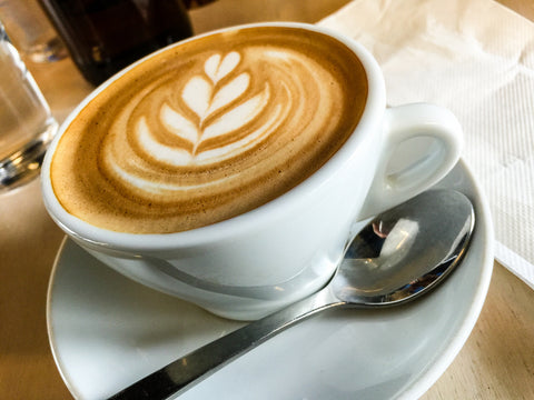 fresh cup of coffee with tree shape foam