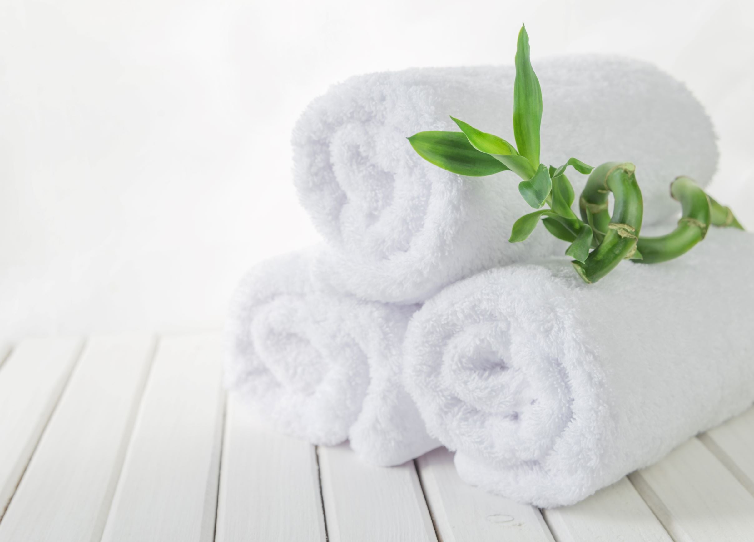 A Stack of White Bamboo Towels