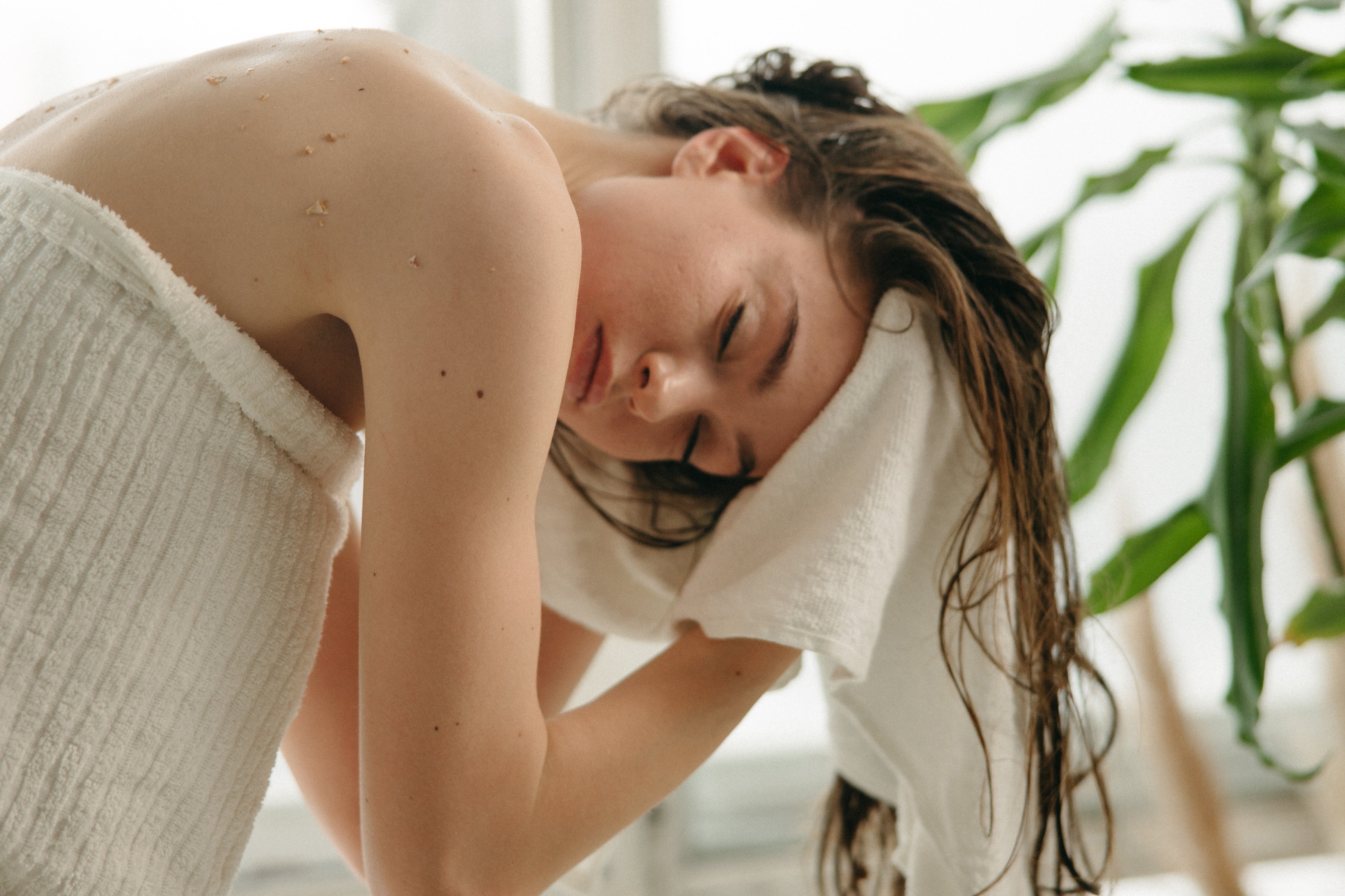 Beautiful Woman Drying Her Hair with Bath Towel