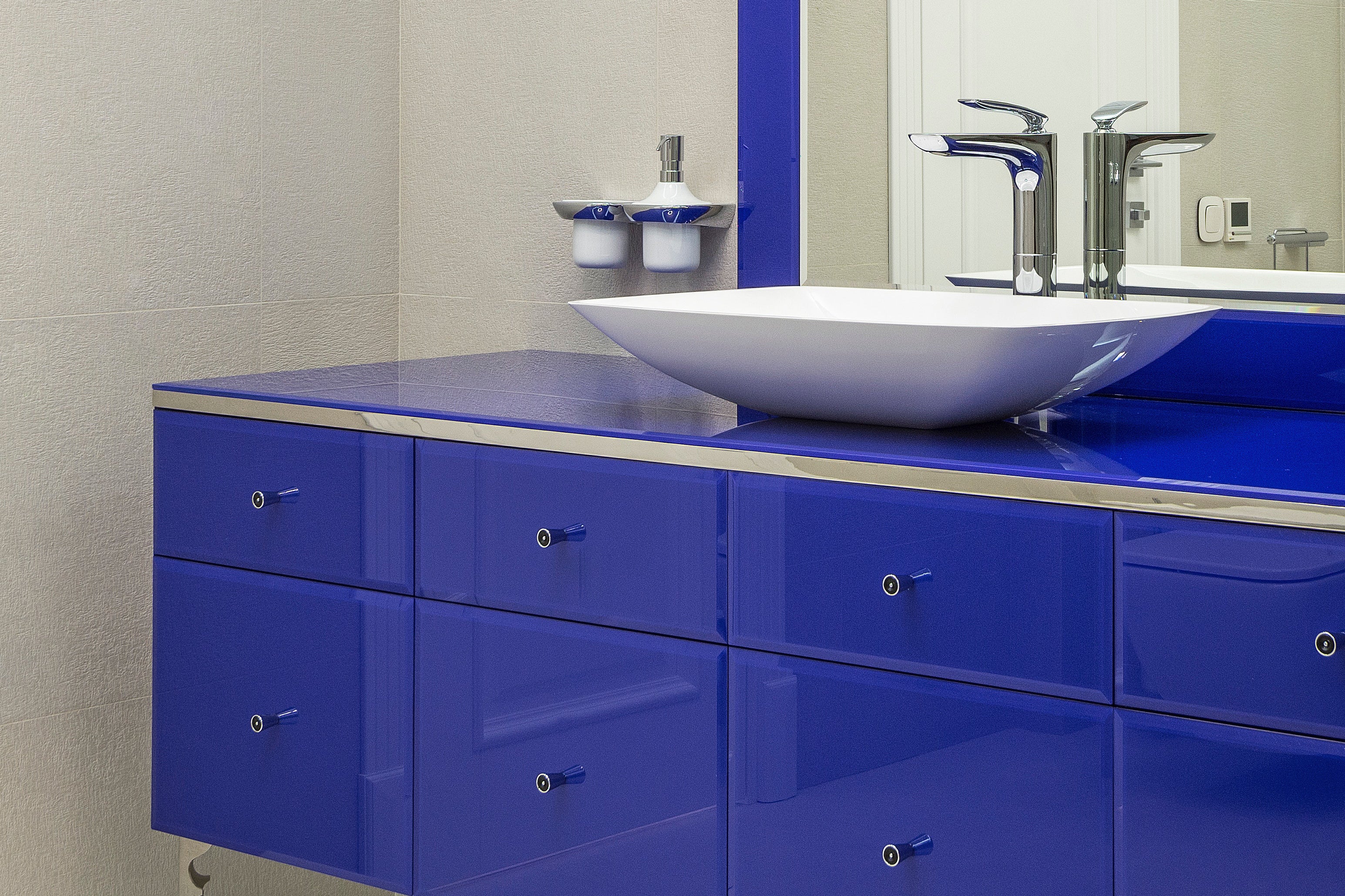 Blue furniture in modern bathroom