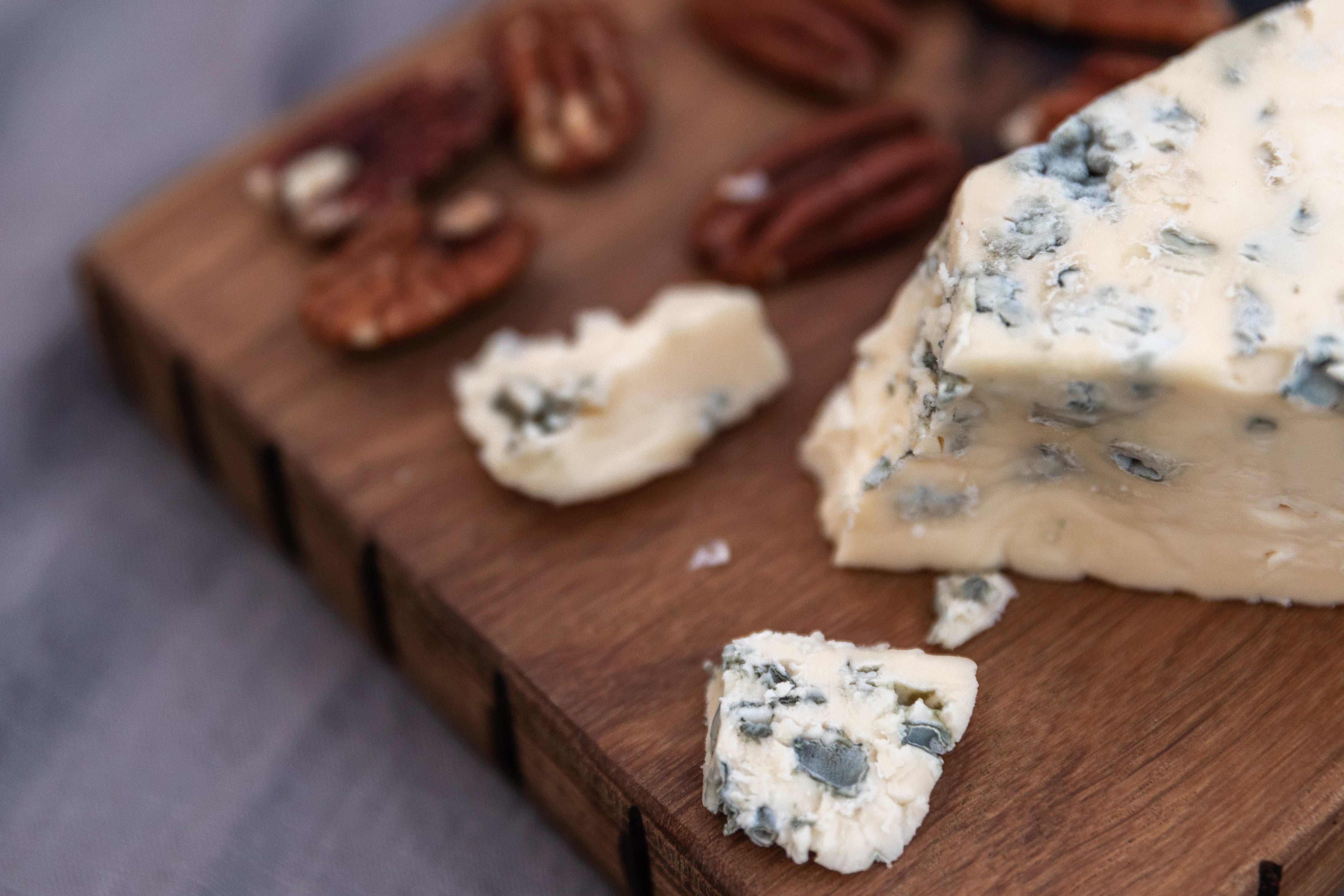 Blue Cheese and Pecans on a Cutting Board