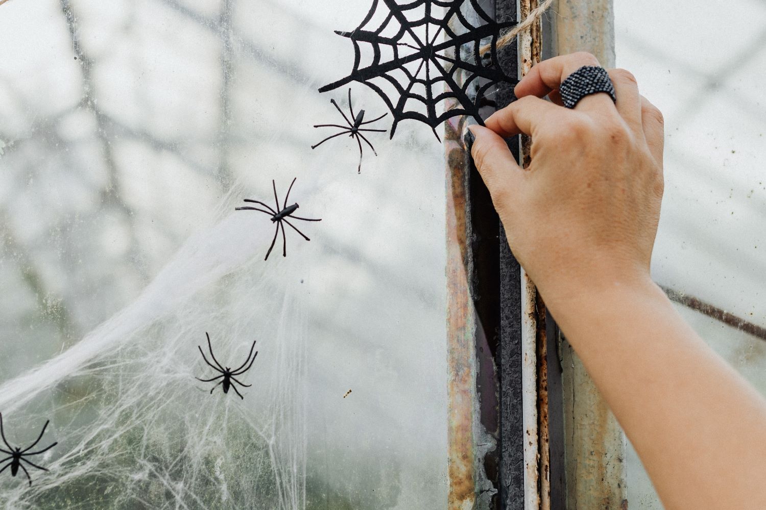 Hand Putting Halloween Decorations