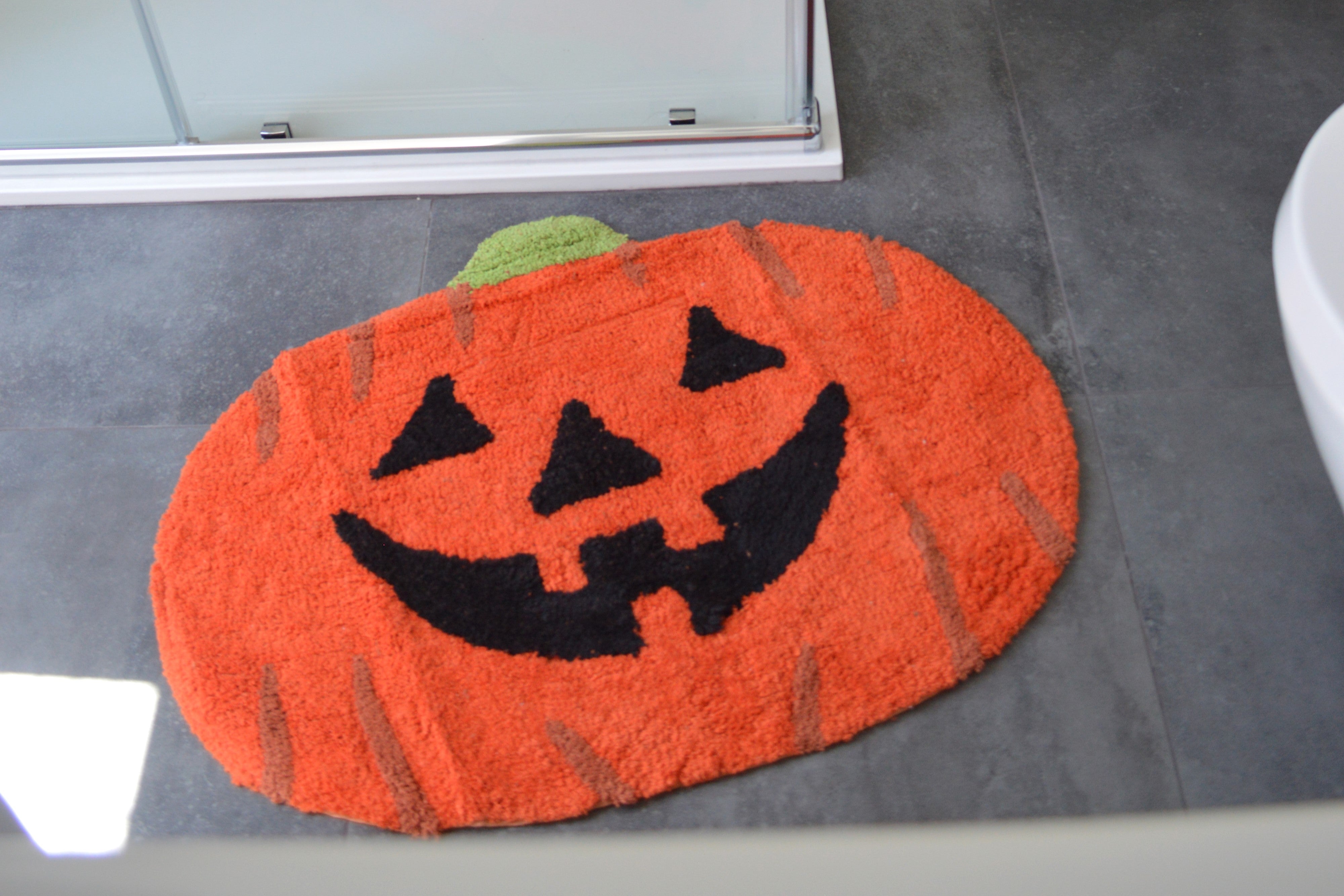 Pumpkin Bath Mat outside a Shower