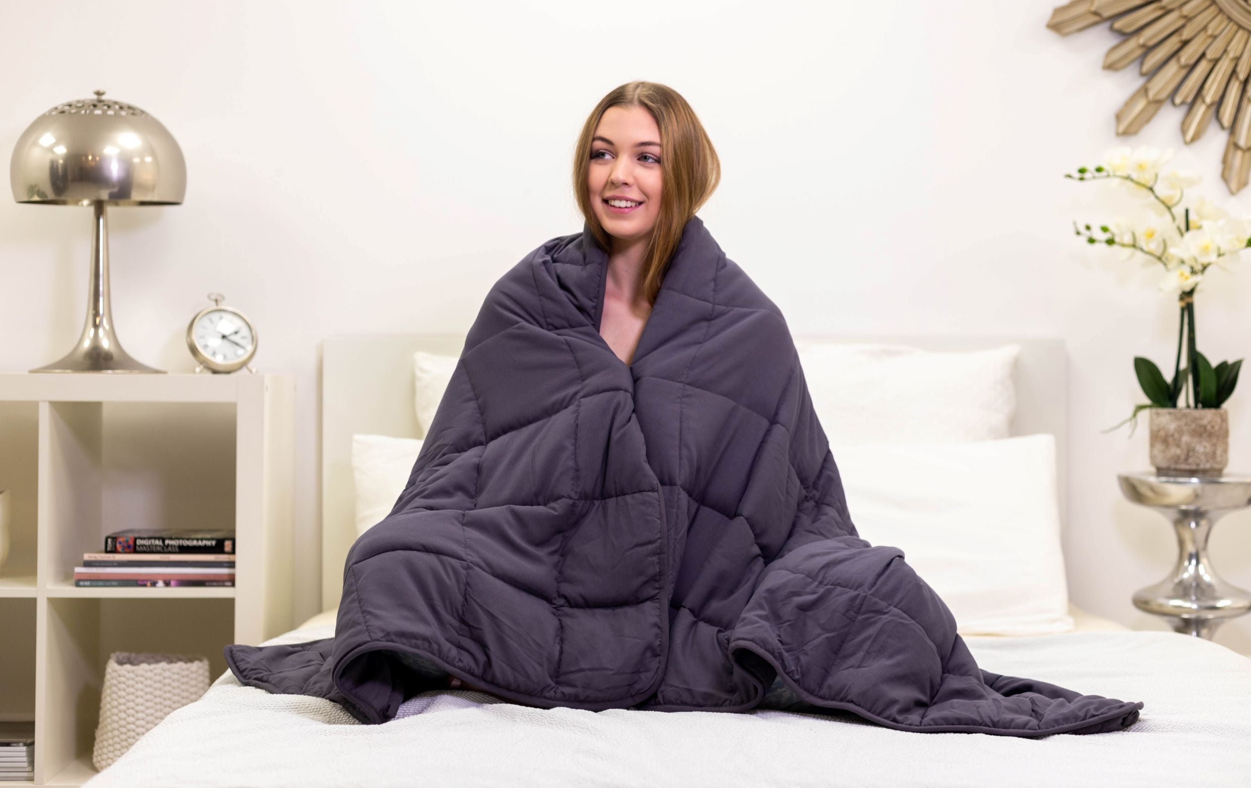 A woman using a Weighted Blanket