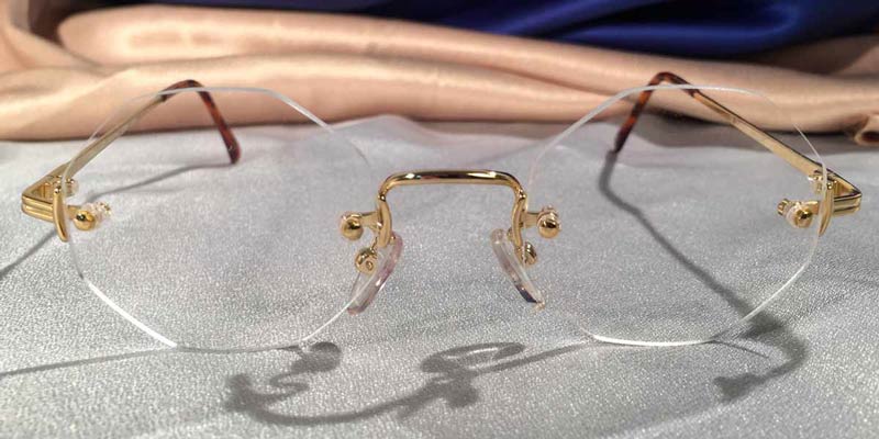 Gold rimless eyeglasses with octagon lenses