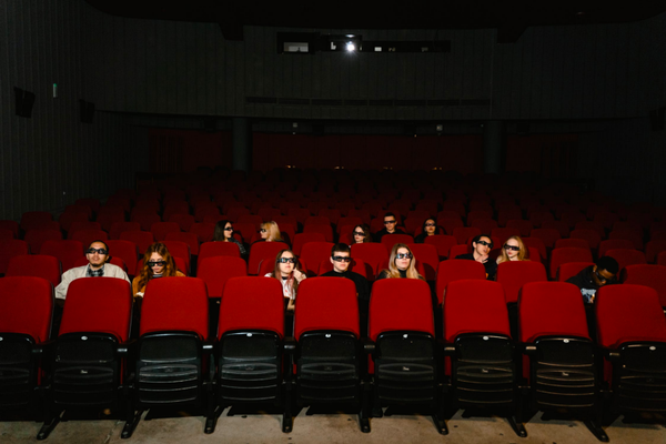 people watching a movie in a movie theater
