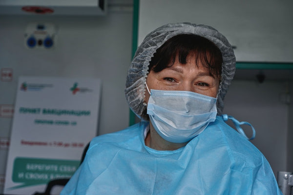 Senior nurse with mask during her shift