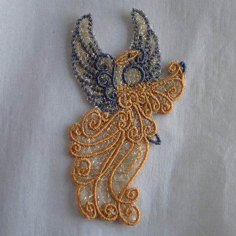 Picture of angel drying on towel after water soluble stabilizer removed at Sew Inspired by Bonnie.