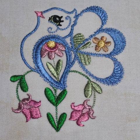 Blue machine embroidered bird with metallic thread on Bonnie's Blog at Sew Inspired by Bonnie