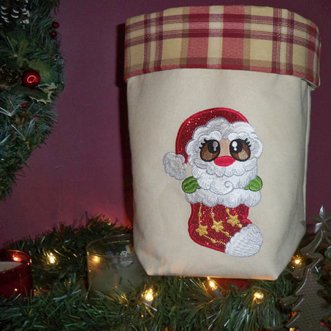 Picture of machine appliqued Santa on fabric basket at Sew Inspired by Bonnie