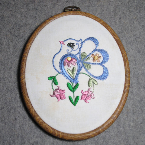 Machine embroidered blue bird in circular wooden frame on Bonnie's Blog at Sew Inspired by Bonnie