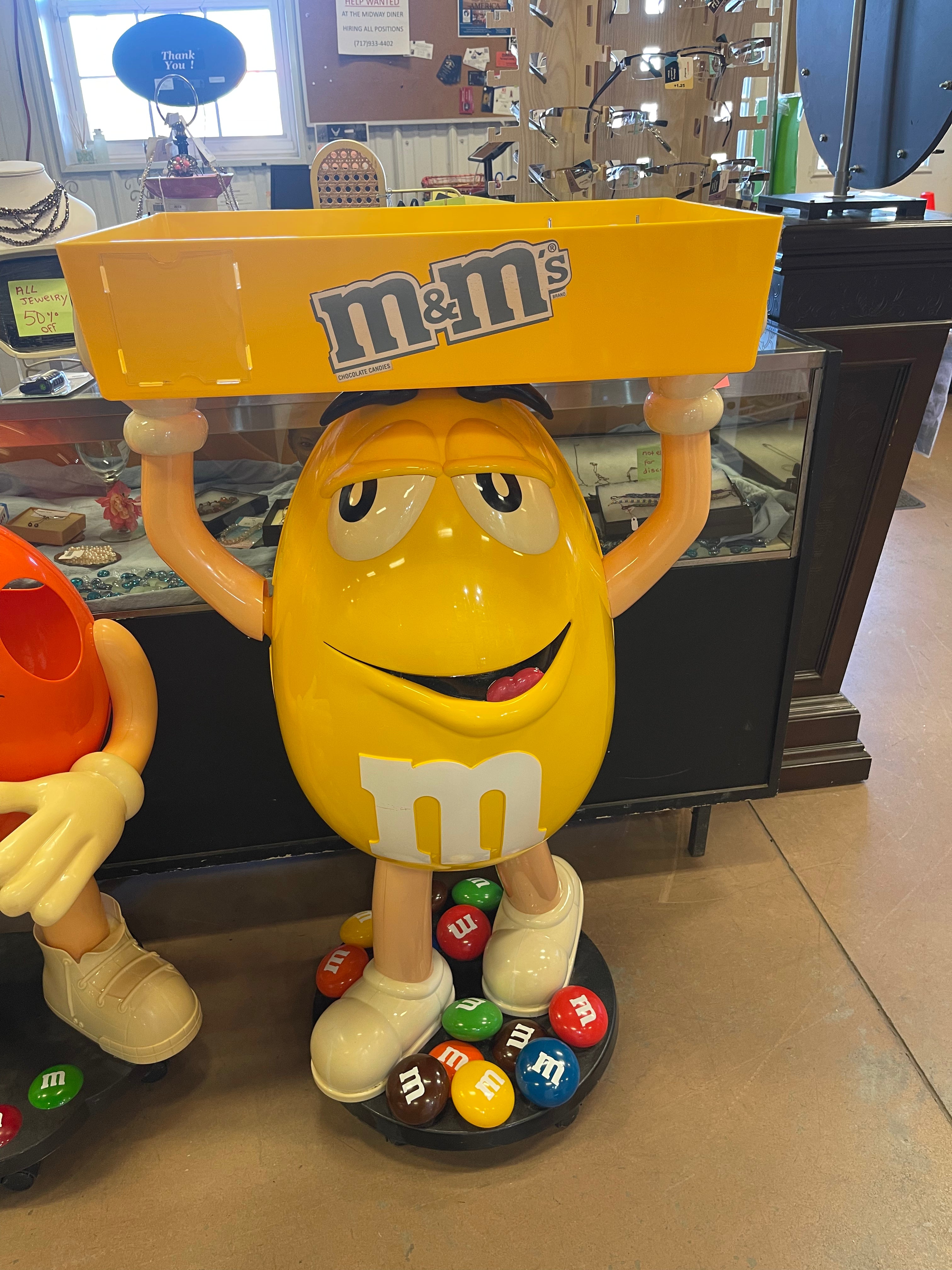 M&M Yellow Character Candy Store Display w/ Storage Tray
Rolling Wheels
(47” tall)
used condition