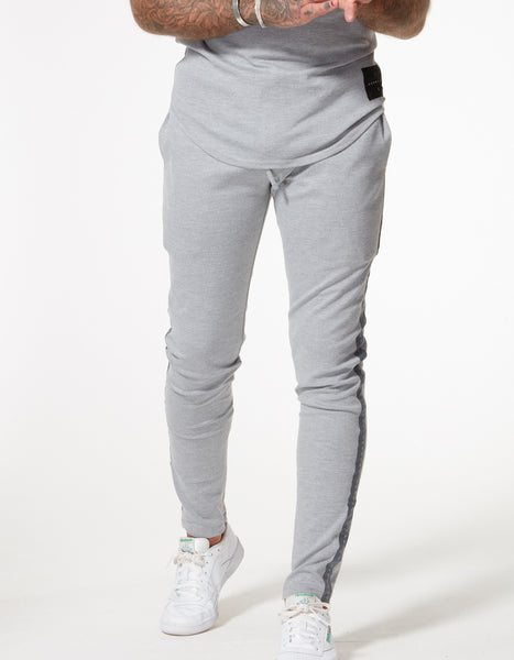 TAPED JERSEY TRACK PANT MARL GREY | H E R M A N O