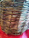 This is a photo of one of the baskets I made in 2021. I have a candle inside.