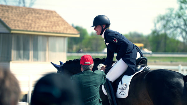 Successful happy female equestrian dressage competitor