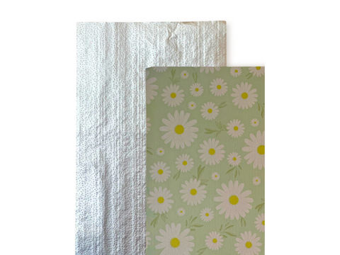 The front and back of the Boo Boo Foil in Sage. Showcasing the beautiful Daisy Pattern on front and embossed design on back!