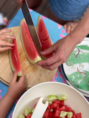 watermelon on bamboo chopping board 