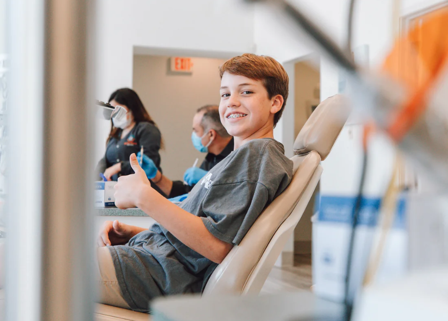 smiling patient in a dental chair