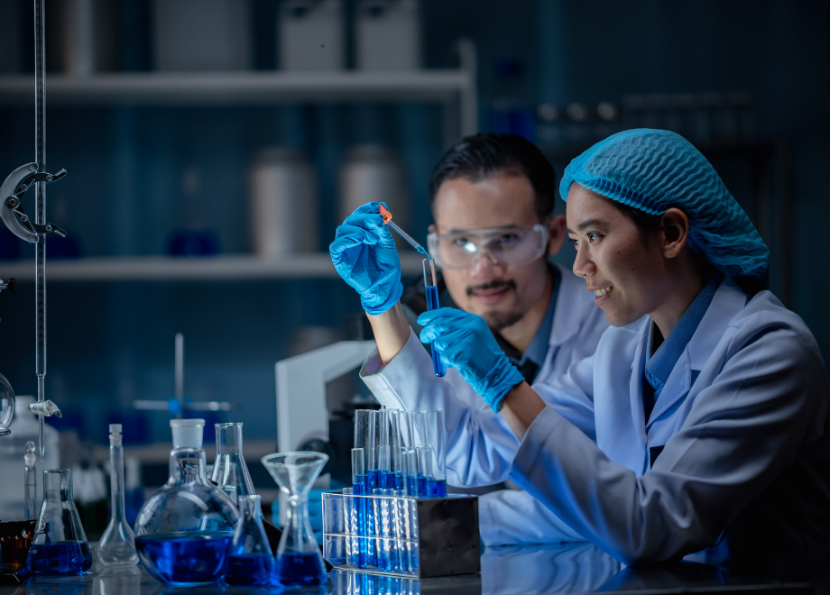 scientists wearing disposable gloves and doing tests