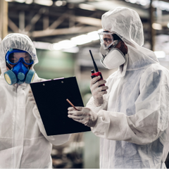 people wearing PPE and reviewing infection control tasks