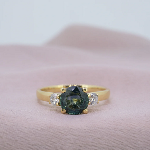 Montana sapphire engagement ring with yellow gold