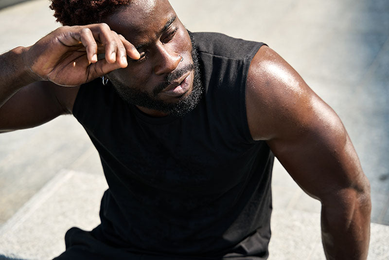 Man in workout gear sweating