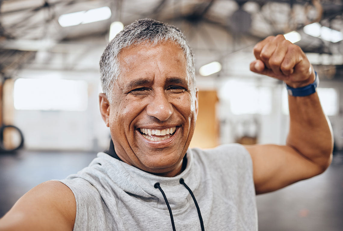 Man smiling confidently in exercise clothes