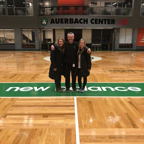 three people in front of Celtic court