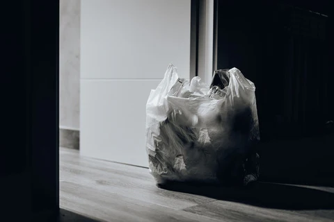 plastic bag filled with trash