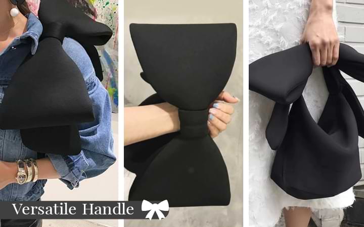 Comfortable and versatile handle of the Belle Bow Bag shown. Black bag carried on the shoulder, wrist and in hand