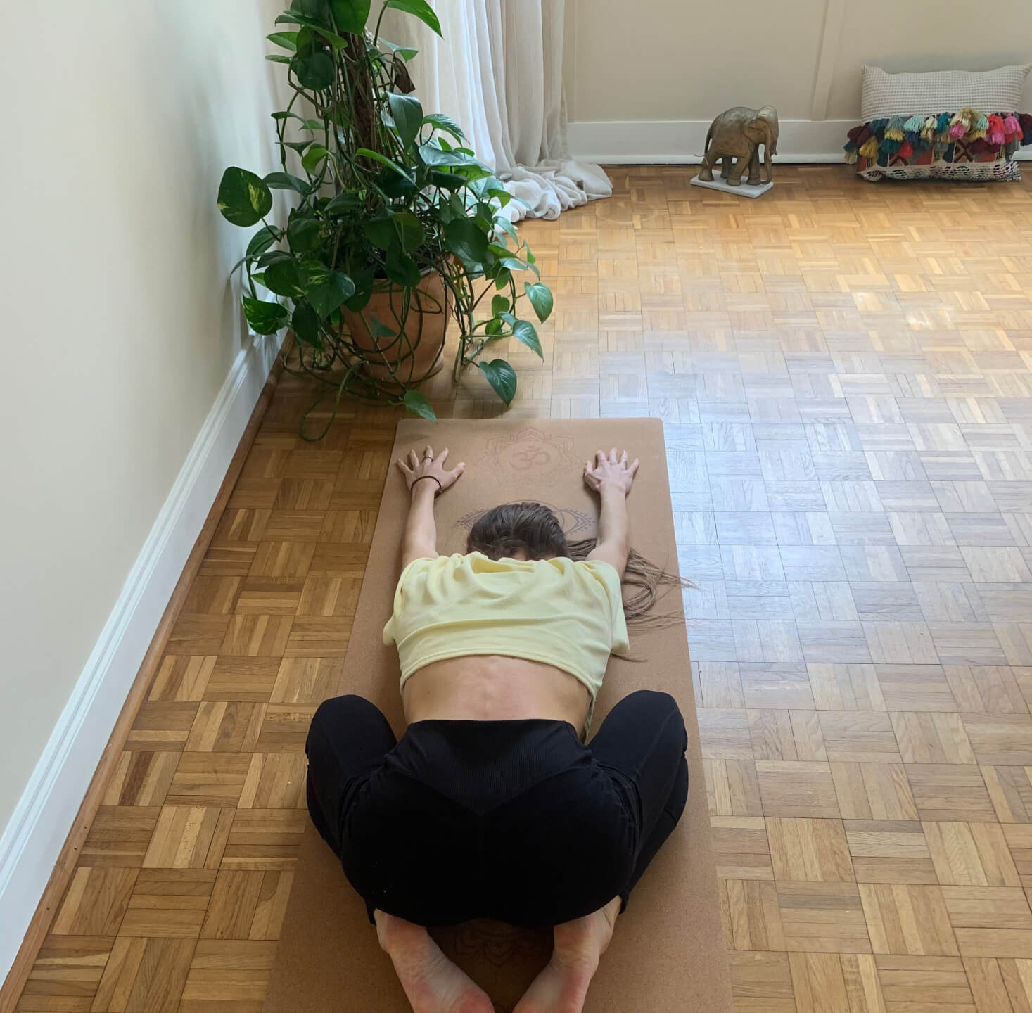 Amy Nevins demonstrating child pose