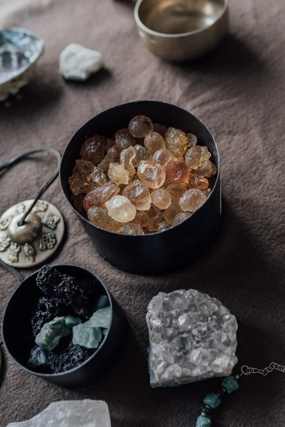 Crystals and Tibetan singing bowl on table