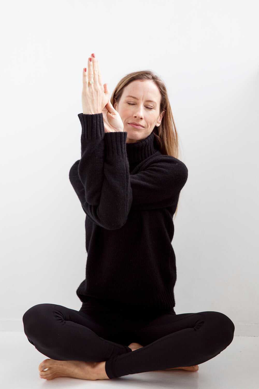 Sarah Ferguson from Yoga Online sitting cross legged