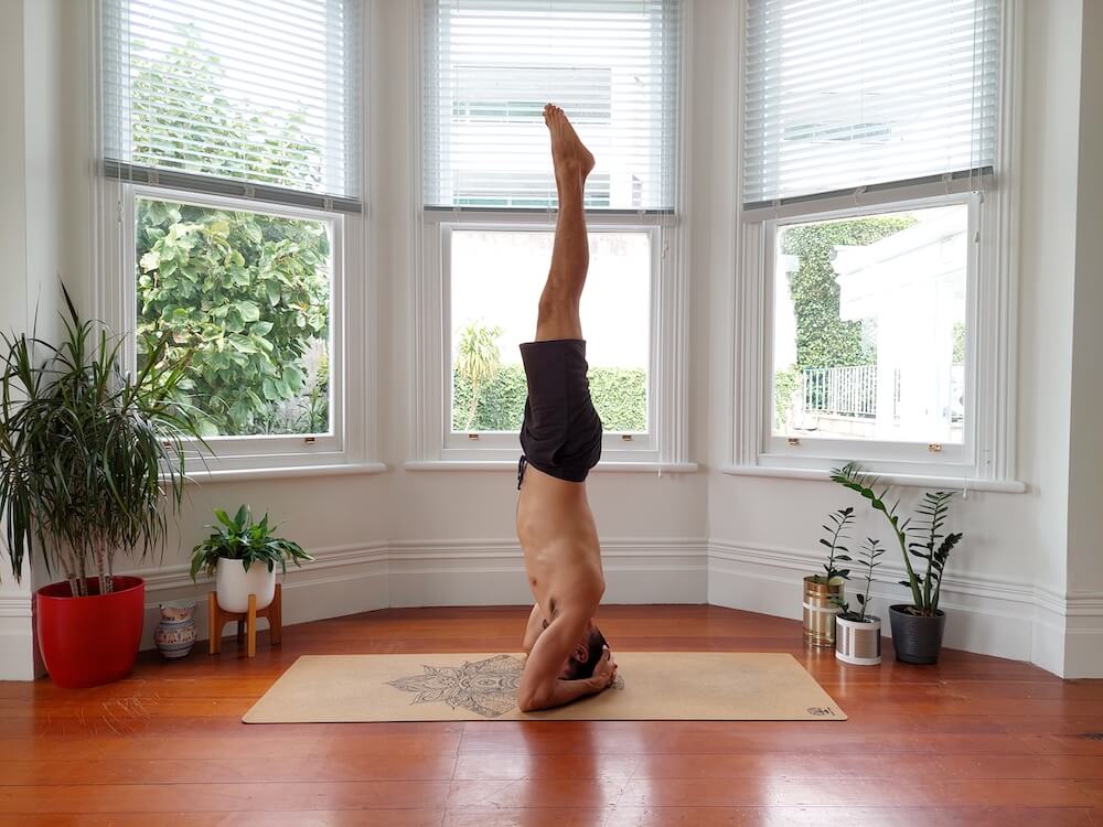 Jaroslav performing yoga headstand pose