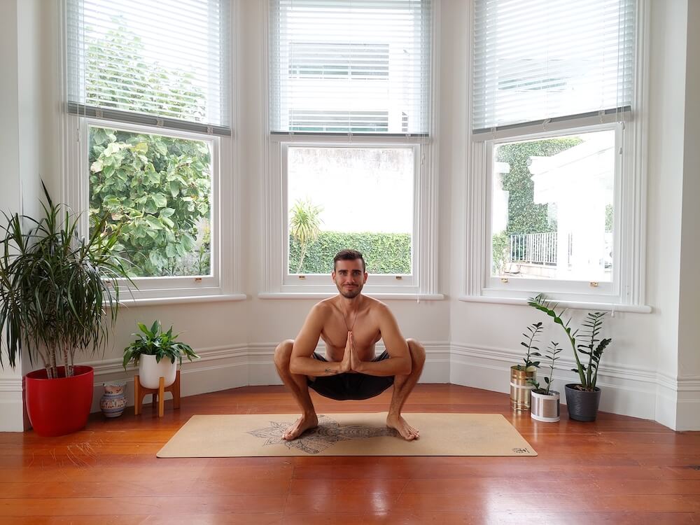 Jaroslav performing yoga wide squat pose