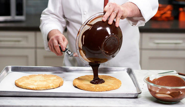 Chef Jacques Torres demonstrating filling with ganache