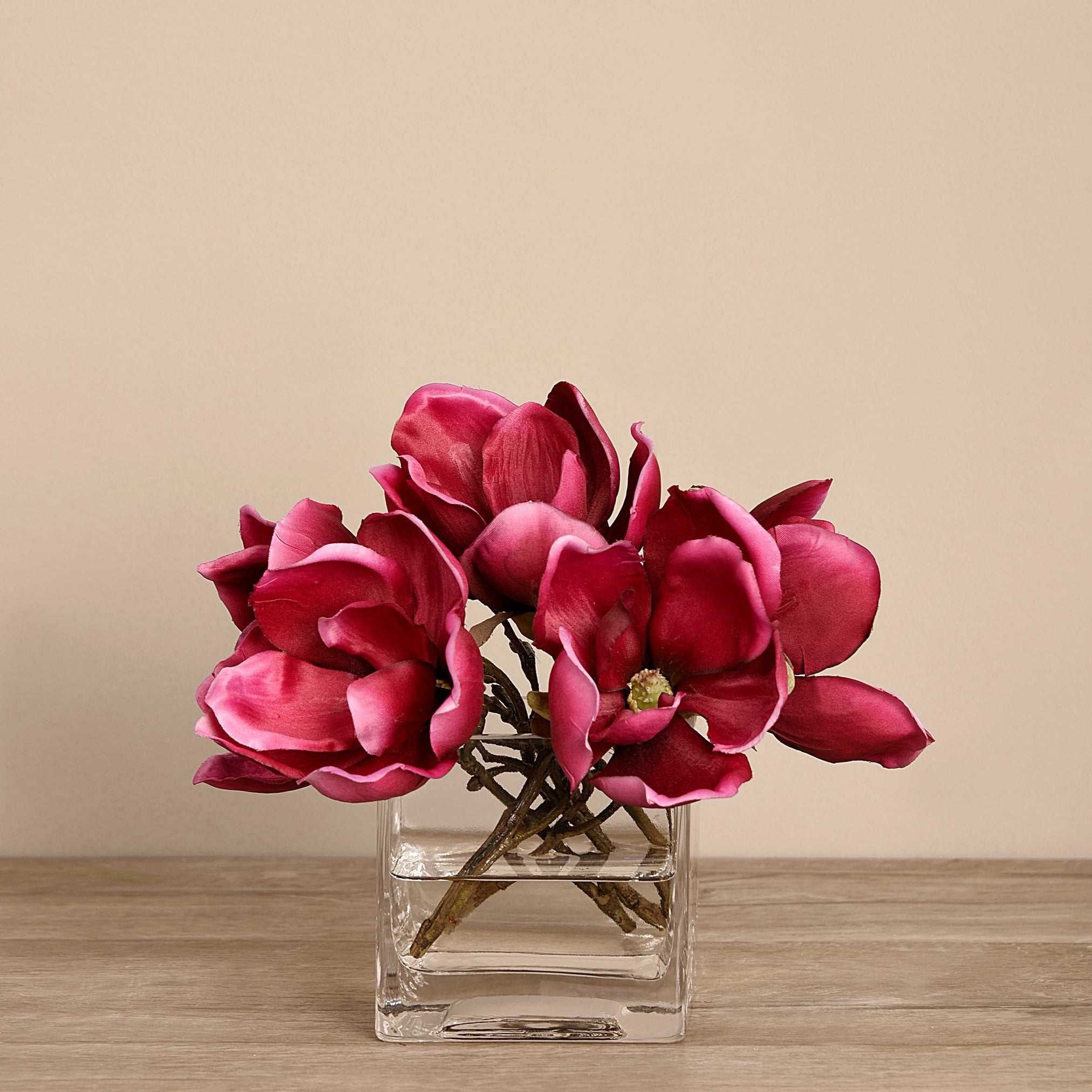 artificial flowers in glass vase