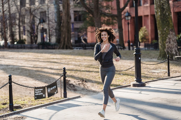 A woman running in a good mood