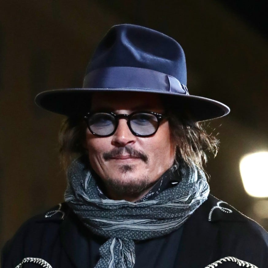 Johnny Depp wears a blue fedora at the San Sebastian Film Festival