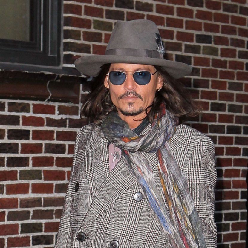 Johnny Depp wears a gray fedora with a pencil curl brim hat to the set of Late Night With David Letterman