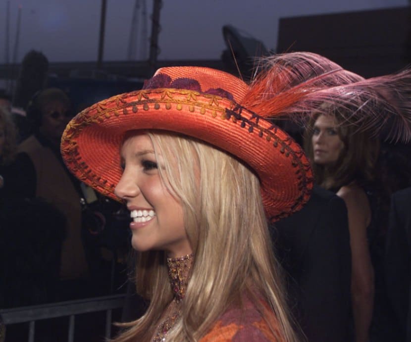 Britney Spears at the Billboard Music Awards in an embroidered red women’s cowboy hat with an exotic feather plume.