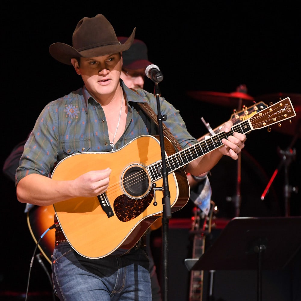 Pardi performs in a chocolate brown felt with matching hatband