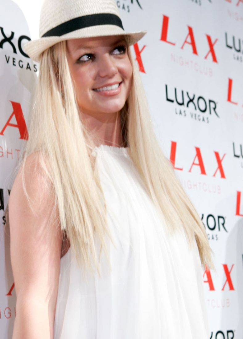 Britney Spears in a straw trilby hat at LAX Nightclub