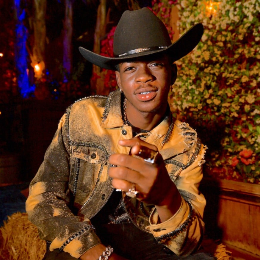 Lil Nas X wears a black 1000x cowboy hat at Stagecoach