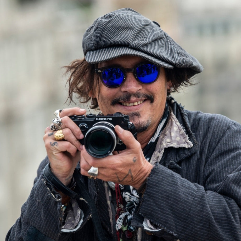 Johnny Depp wears a striped newsboy hat at the BCN Film Festival