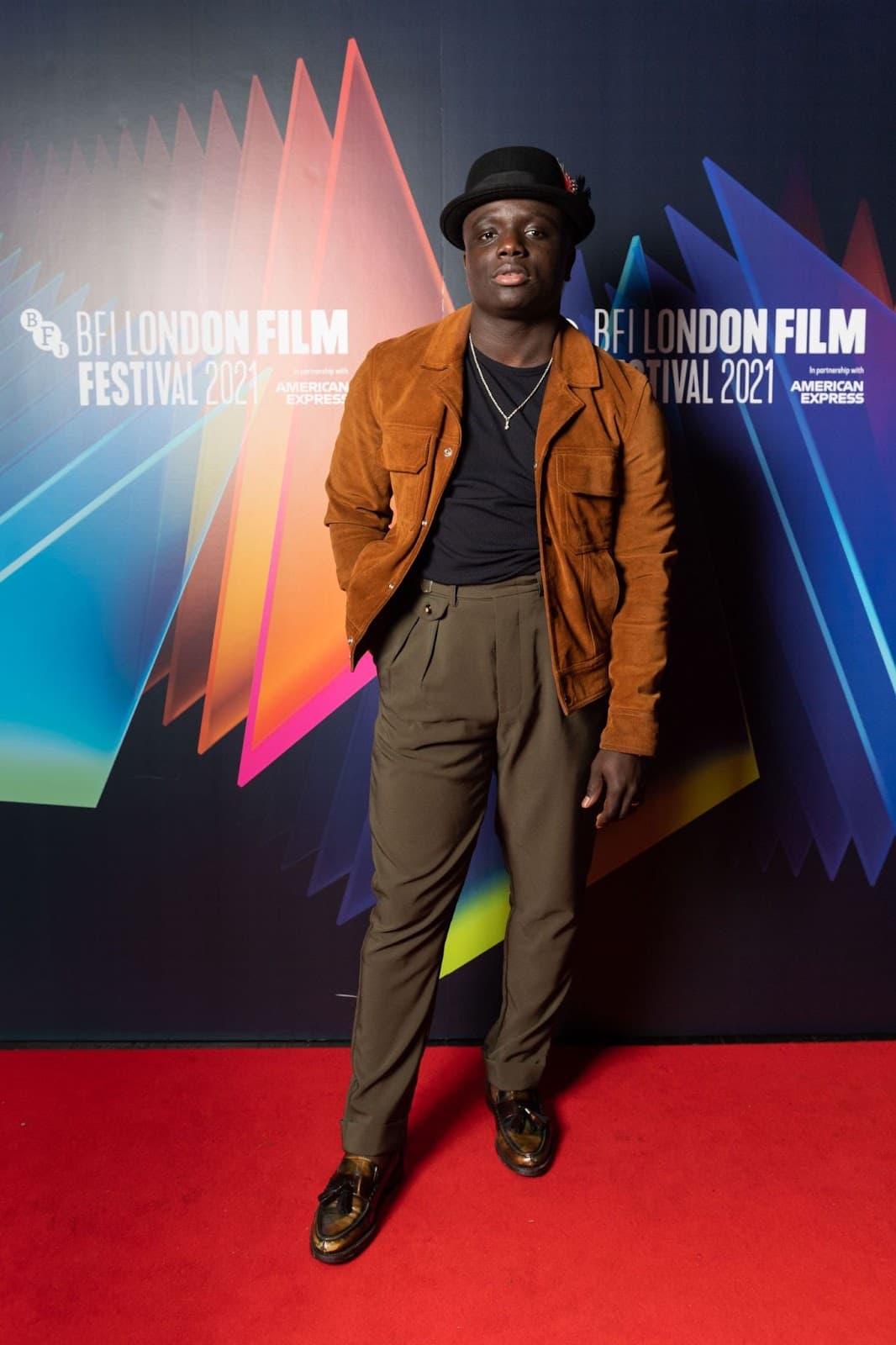 Diong-Keba Tacu wore a black bowler hat and corduroy jacket at the 65th BFI London Film Festival (Ian Gavan/Getty Images for BFI).